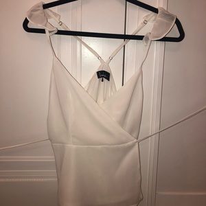 wrap blouse with ruffled shoulder